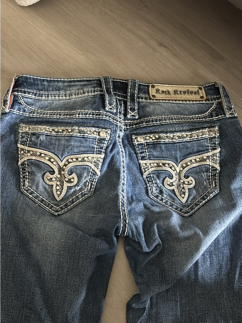 Rock Revival Women's Distressed Blue Bootcut Jeans with Embellished Pockets